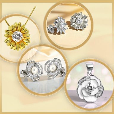 Floraler Schmuck: Halsketten und Ohrringe in Blumenform, teils mit Perlen, teils mit funkelnden Kristallen verziert.